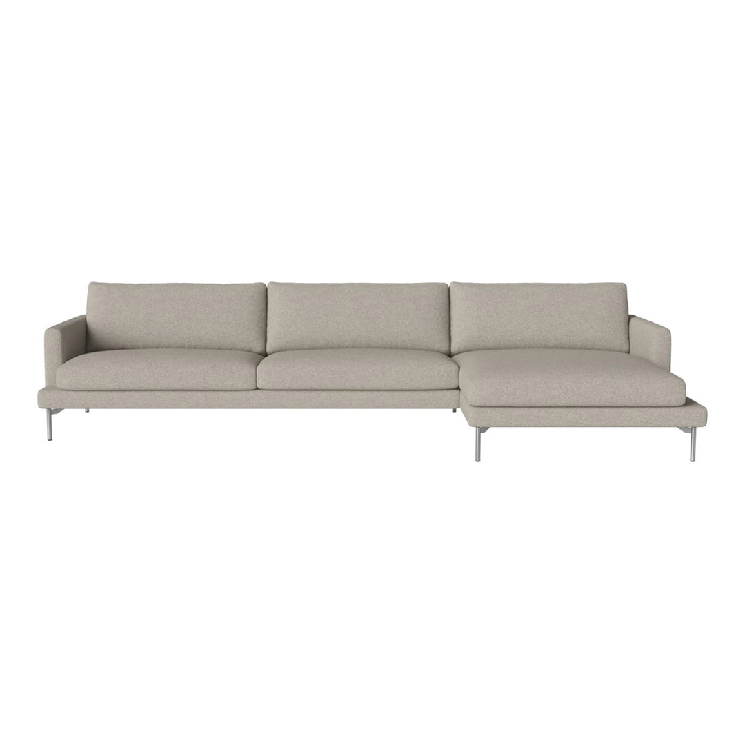Light gray sectional sofa with minimalist design and smooth fabric finish, featuring no patterns.