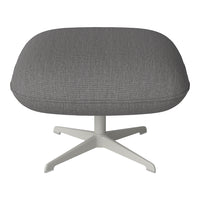 Gray textured upholstery on a contemporary chair with a sleek white base. Perfect for modern aesthetics.