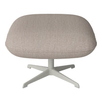 Beige textured upholstered ottoman with a sleek white base, showcasing a minimalist design.