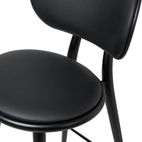 Black sleek chair with smooth curves and a matte finish. Modern design highlights simplicity and elegance.