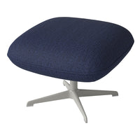 Navy blue textured fabric cushion on a sleek white base, perfect for modern decor.