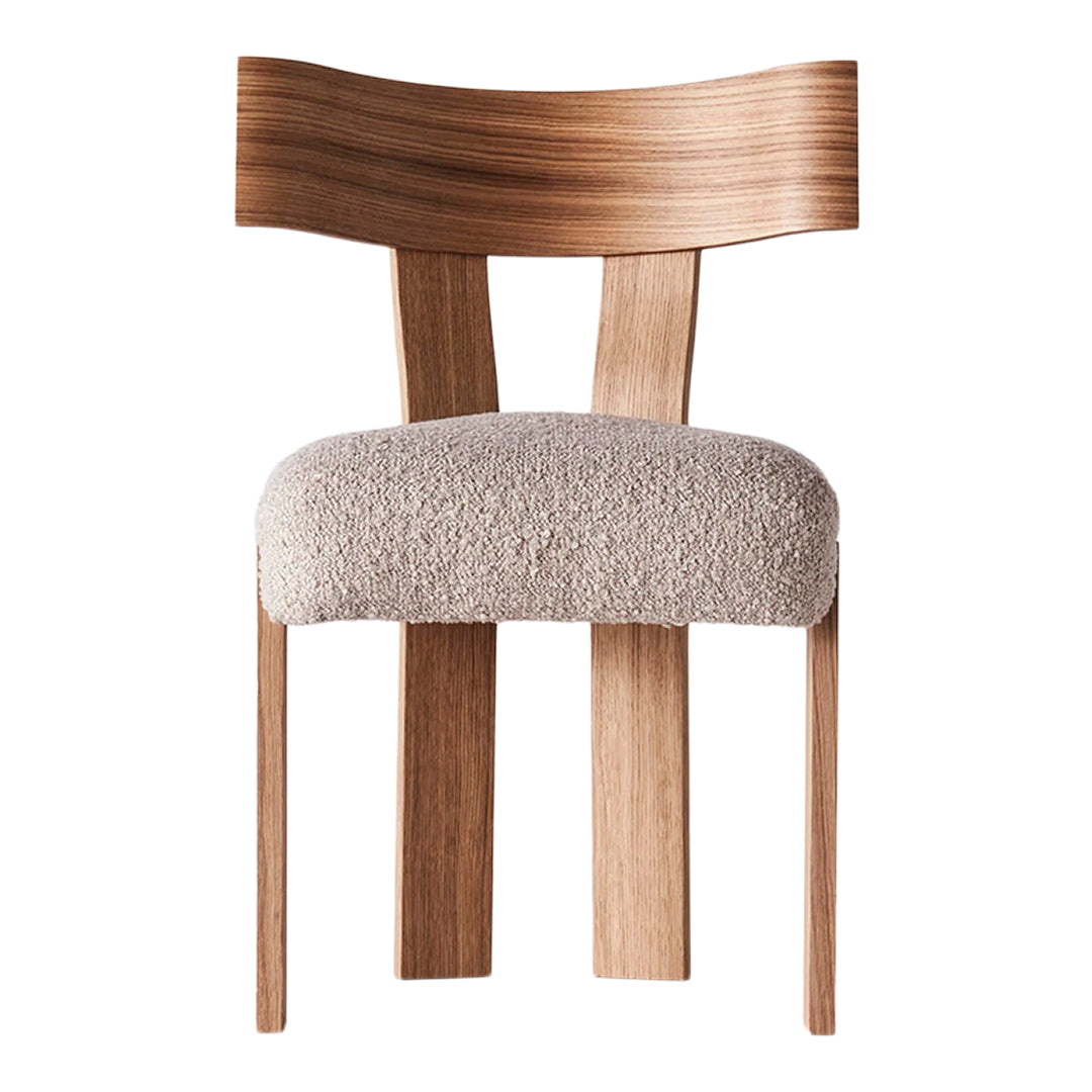 Wooden chair with a light beige patterned seat and a natural wood finish, showcasing smooth lines and minimalist design.