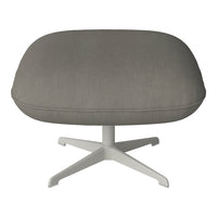 Gray ribbed upholstery on a modern chair with a sleek white base, offering a stylish, contemporary look.