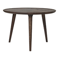 Round wooden table with a dark brown finish and subtle wood grain pattern, featuring slender, tapered legs.