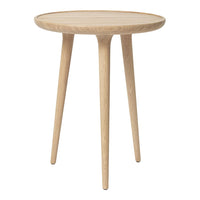 Light oak round side table with a smooth surface and sleek, tapered legs. Minimalist design in natural wood color.