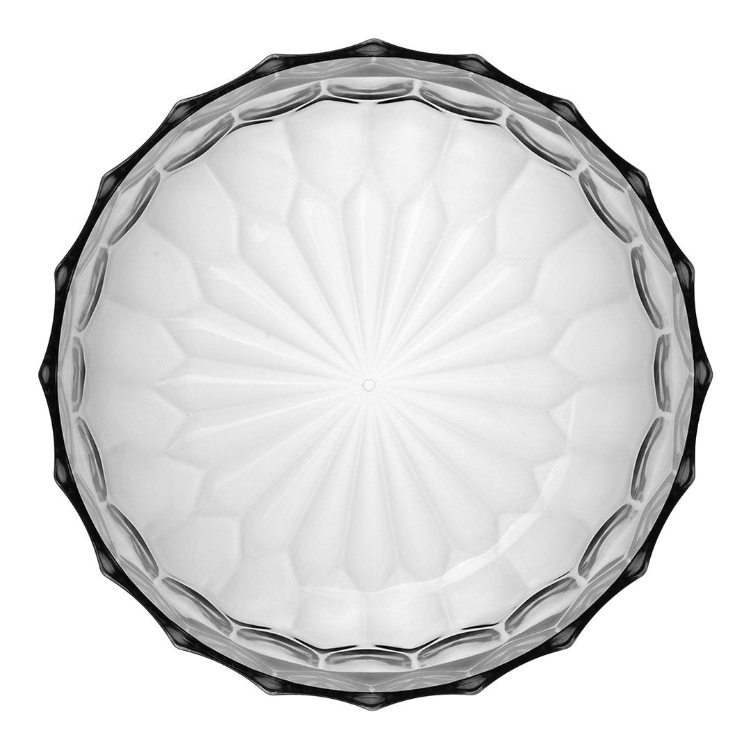 Clear glass bowl with intricate geometric patterns and a scalloped edge, featuring a starburst design at the center.