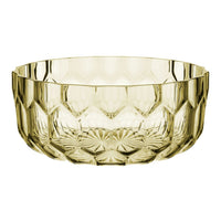 Cut glass bowl in a soft amber hue with geometric patterns, perfect for elegant table settings.