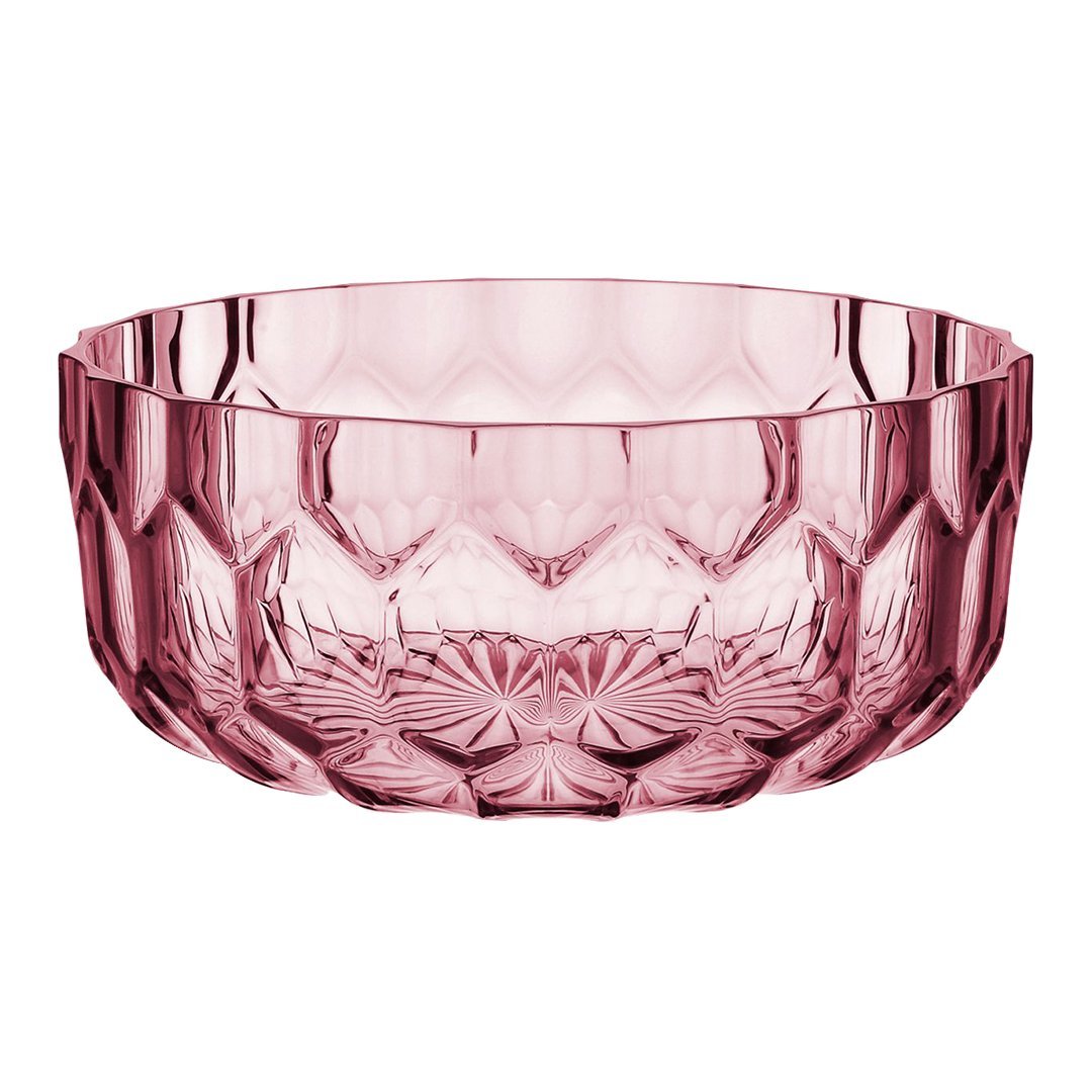 Pink crystal bowl with intricate geometric patterns, adding elegance to any table setting.