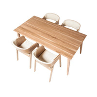 Natural wood dining table with light beige chairs, featuring a sleek, minimalist design and smooth surfaces.