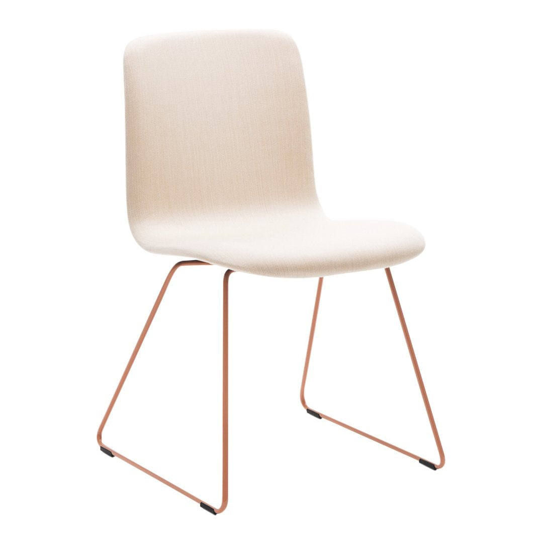 Beige upholstered chair with copper legs, featuring a minimalist design and smooth surface. Ideal for modern decor.