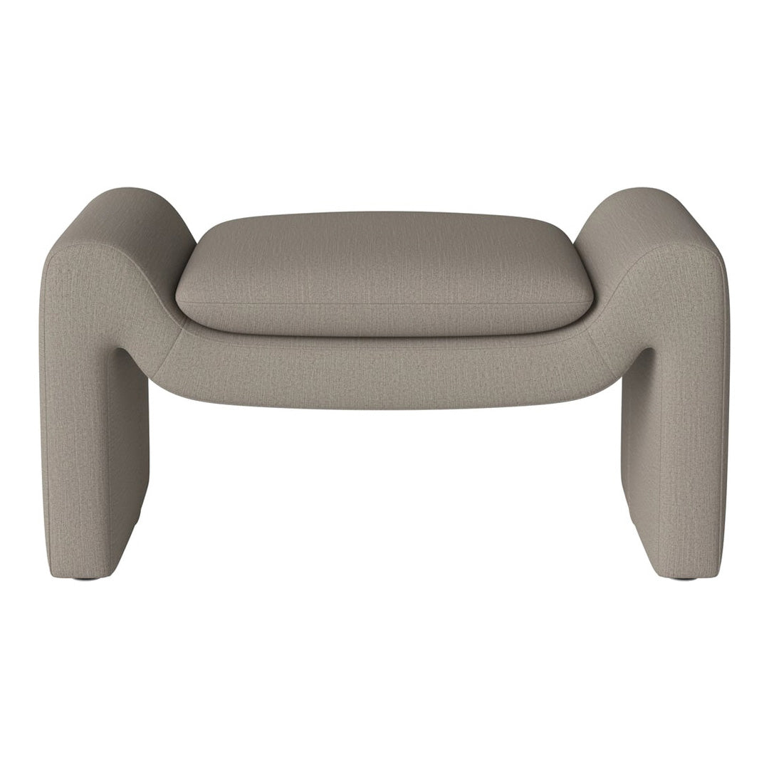 Stylish beige upholstered ottoman with a smooth, textured pattern and modern curved design. Perfect for contemporary decor.