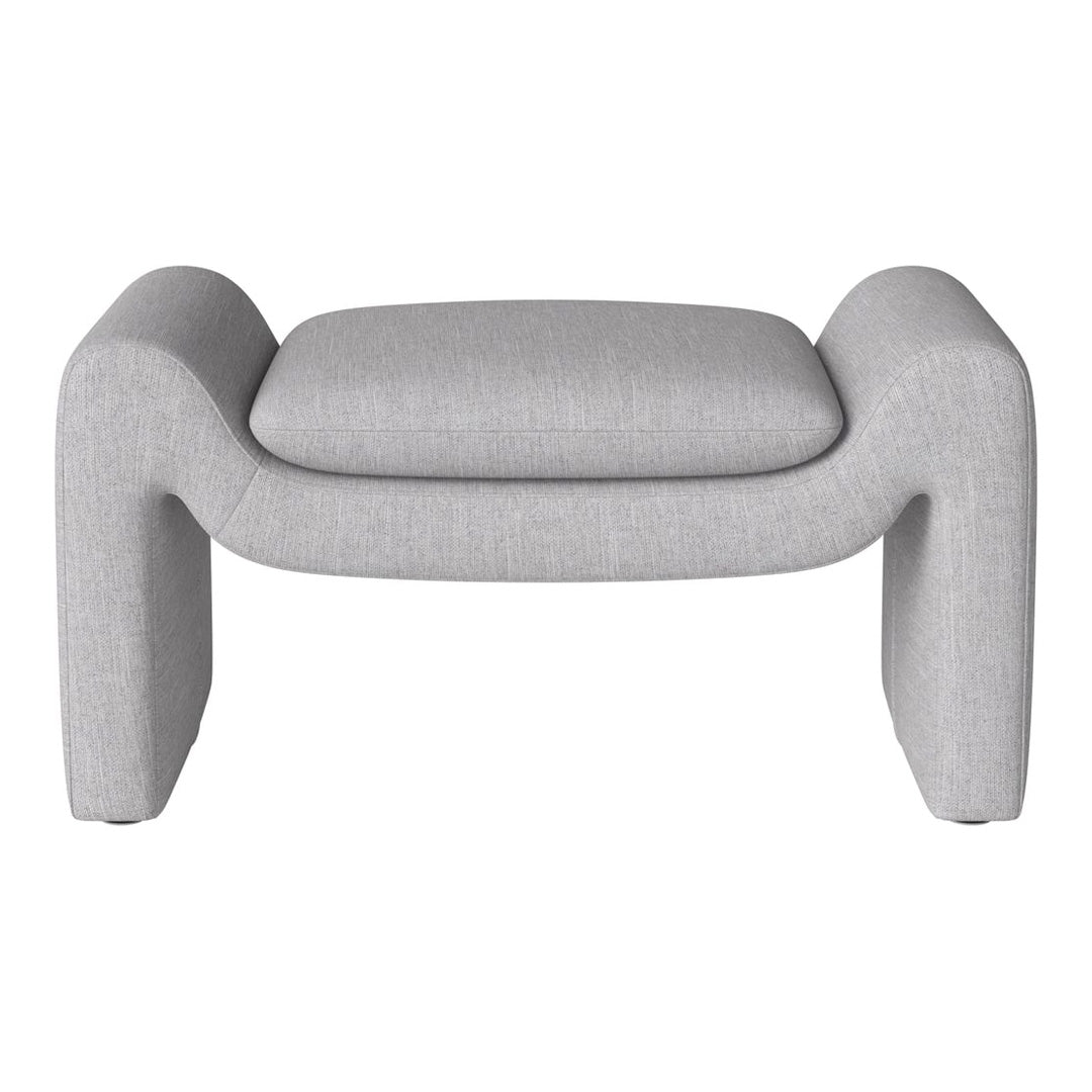 Grey upholstered ottoman with a smooth, textured fabric and minimalist design. Ideal for modern decor.