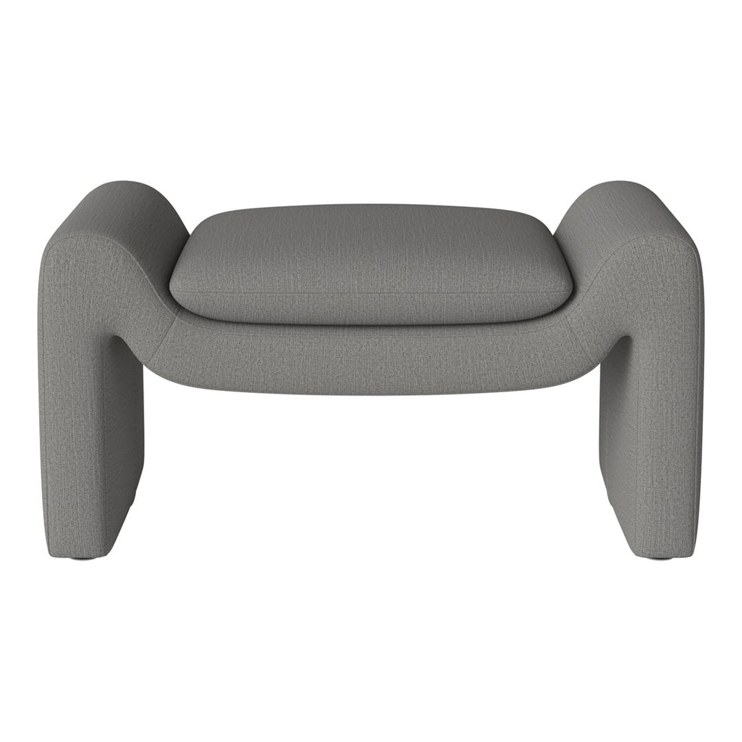 Gray upholstered ottoman with a textured finish and modern design, perfect for contemporary interiors.