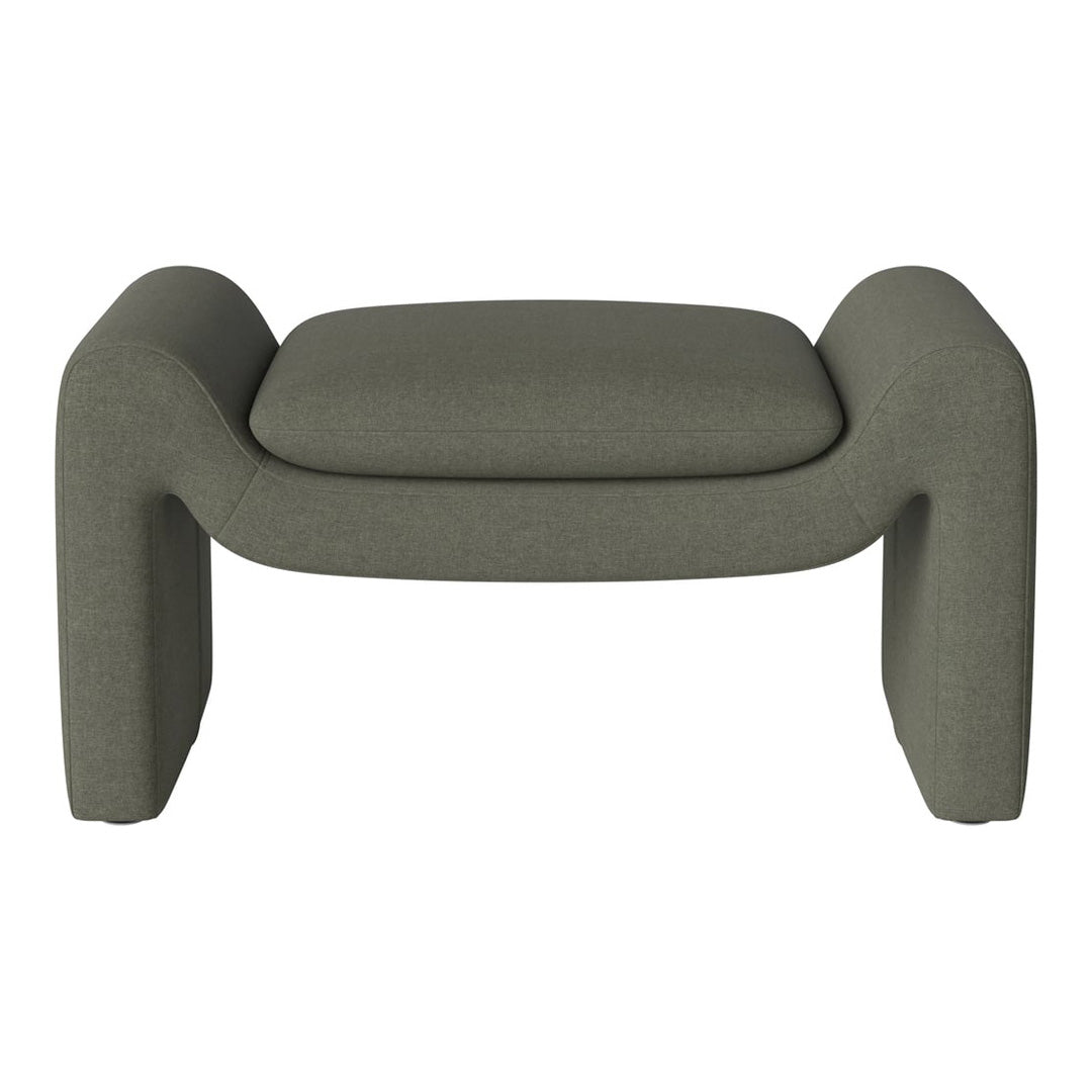Olive green upholstered ottoman with a soft, textured finish and rounded edges, perfect for modern decor.