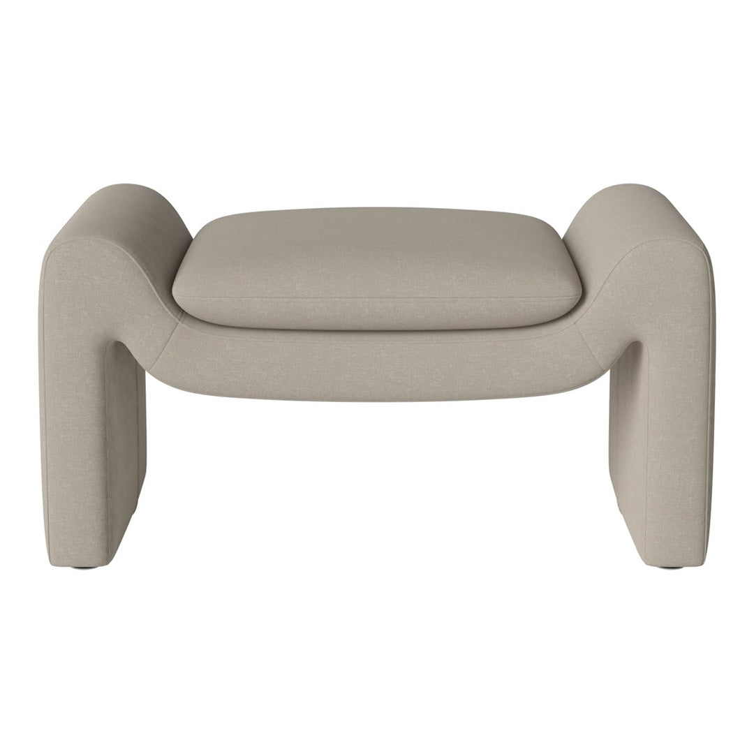 Beige upholstered ottoman with a minimalist design and smooth, clean lines. Perfect for any modern decor.