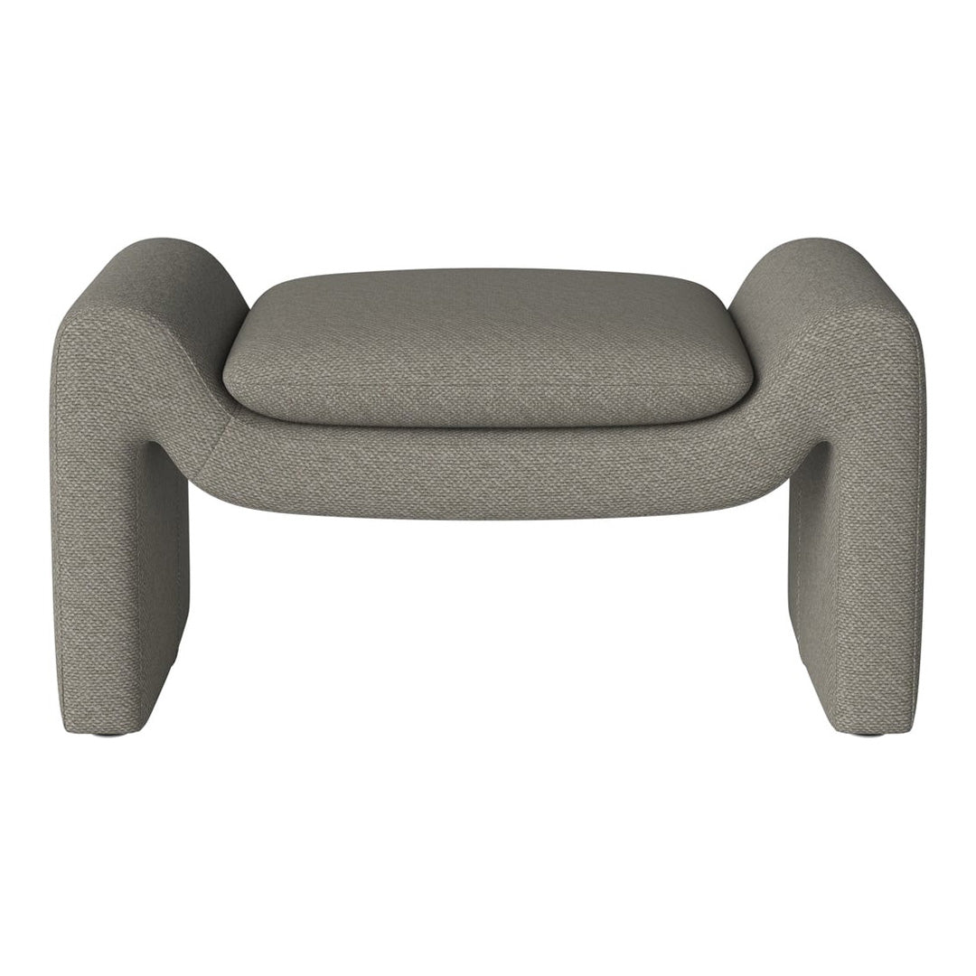 Gray upholstered ottoman with soft texture and rounded edges, perfect for modern decor.