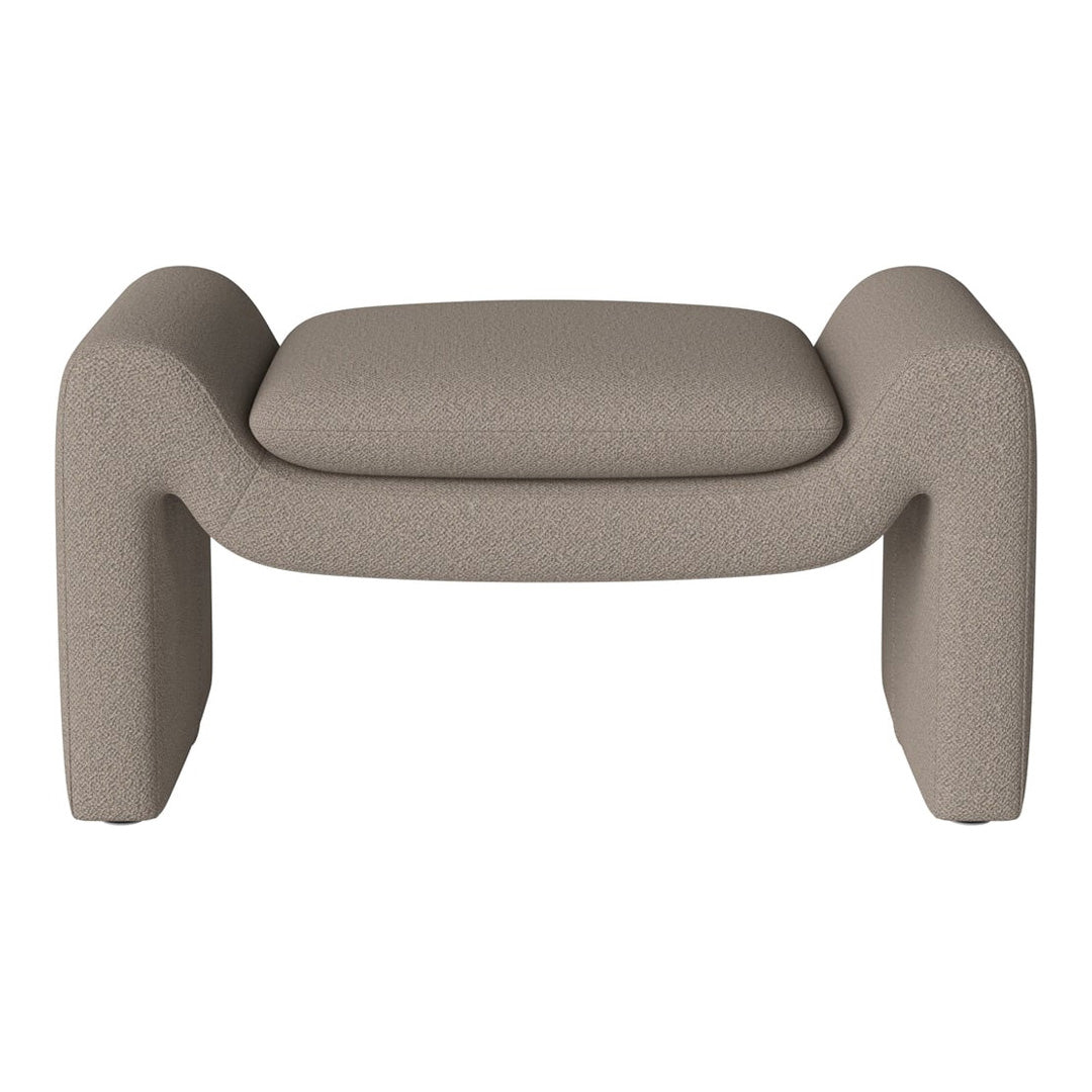 Beige textured ottoman with rounded edges and minimalist design, perfect for modern decor.