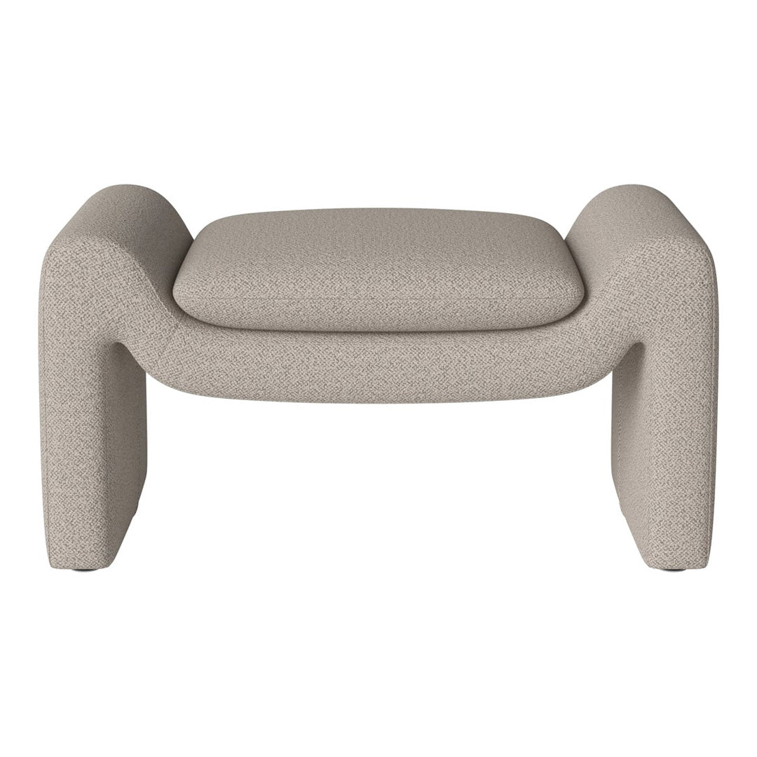 Beige textured ottoman with soft curves and a minimalist design. Ideal for modern home decor.