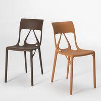 Two modern chairs in rich brown and warm terracotta, featuring sleek, minimalist designs with unique patterns.