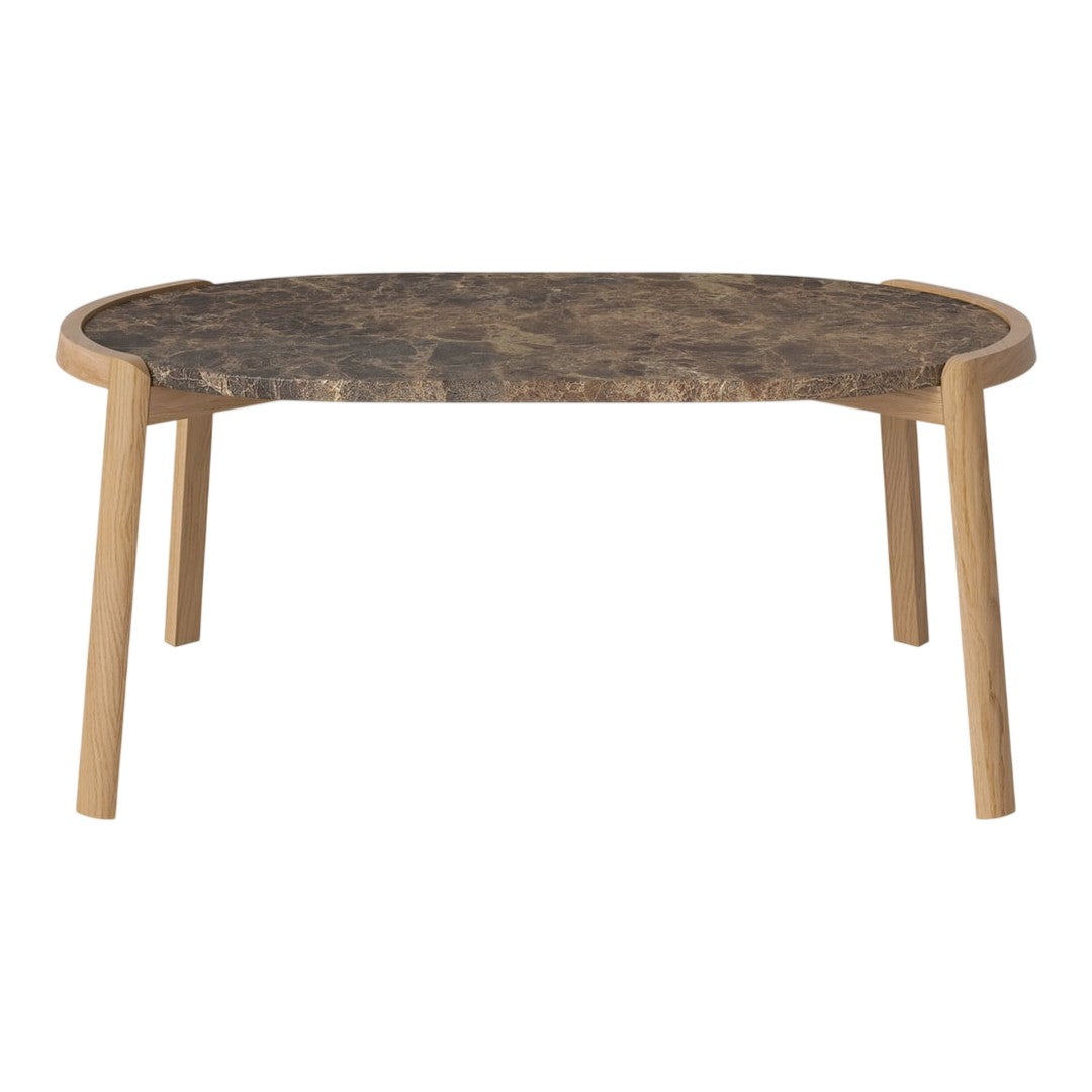 Natural wood table with a dark marble top and light wood legs, featuring smooth curves and a modern design.