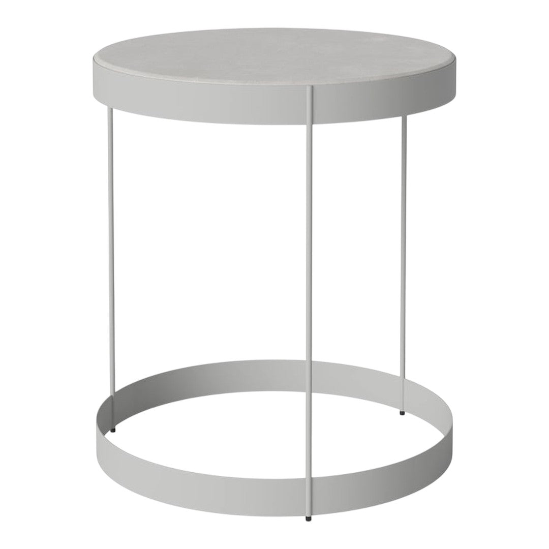 Round gray side table with a sleek, minimalist design and smooth finish. Ideal for modern decor.
