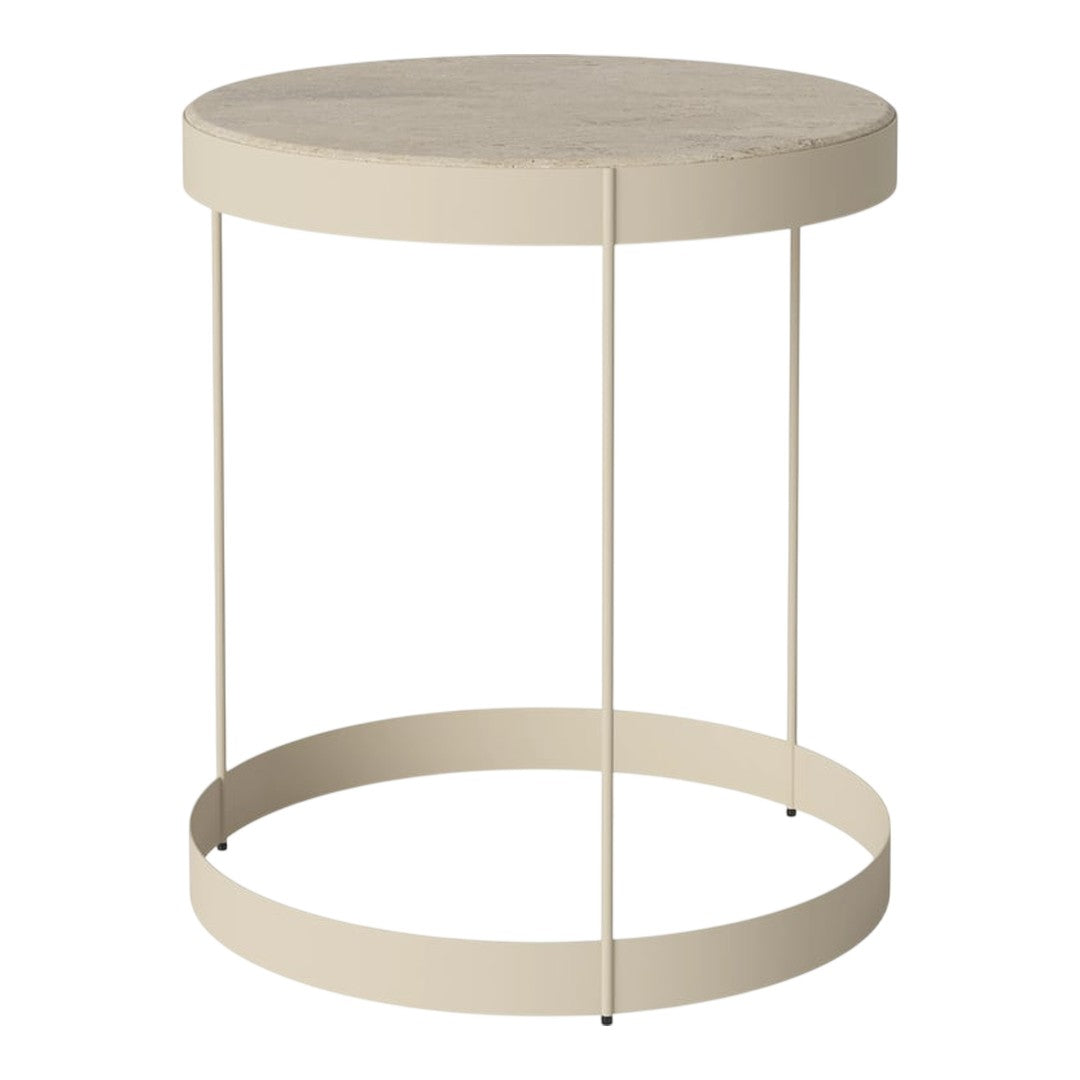 Beige round table with smooth top and minimal metal legs in a modern, simple design. Perfect for any decor.