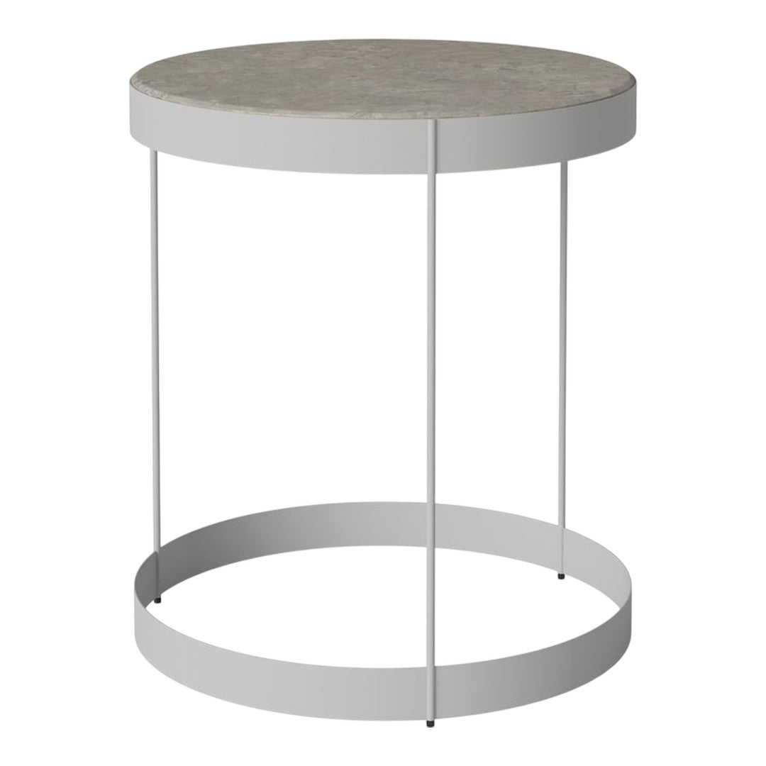 Round side table with a gray stone top and white metal legs, featuring a minimalist design and sleek lines.