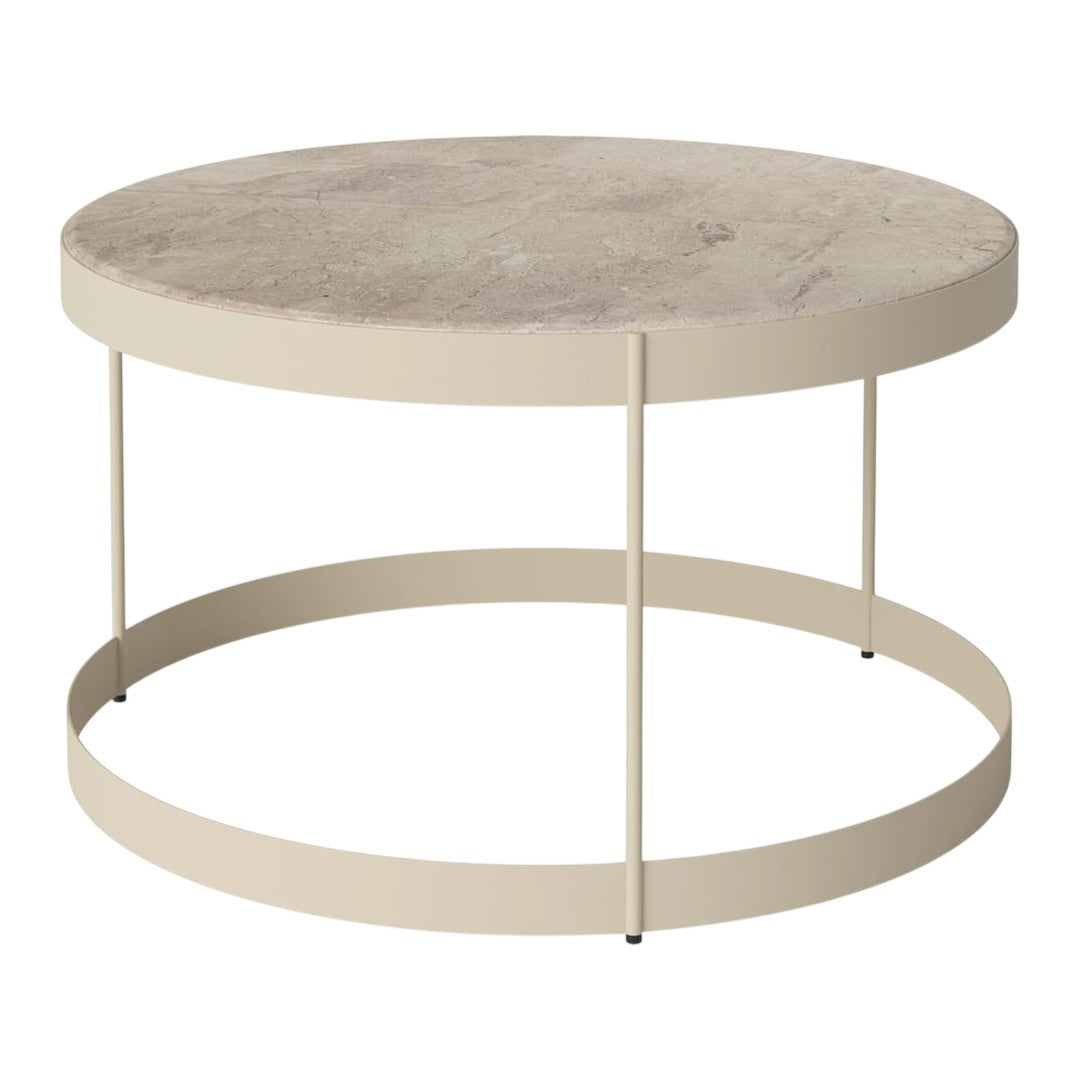 Round coffee table with a beige top and light beige metal frame, featuring a smooth, subtle texture.