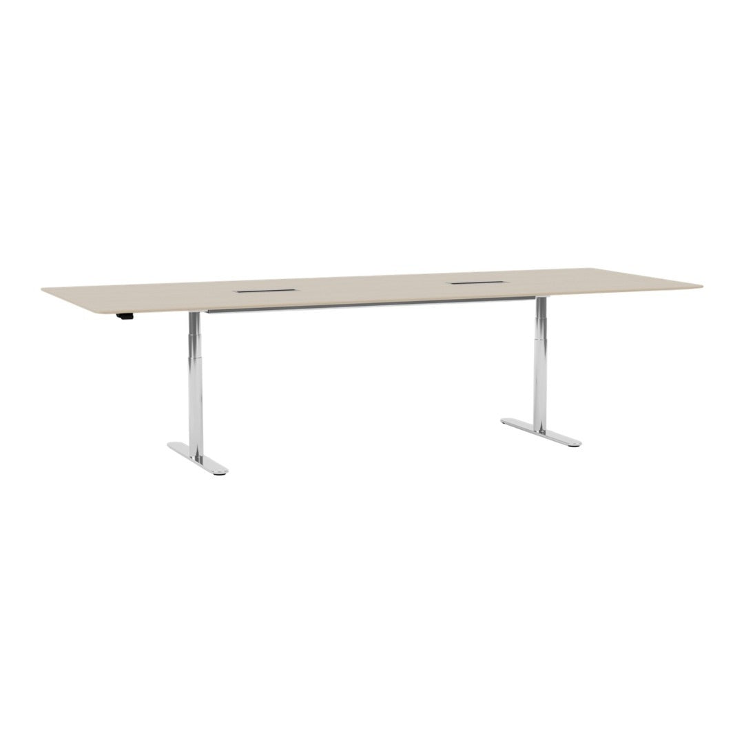 Light beige tabletop with sleek silver legs, featuring a minimalist design and two cable management cutouts.