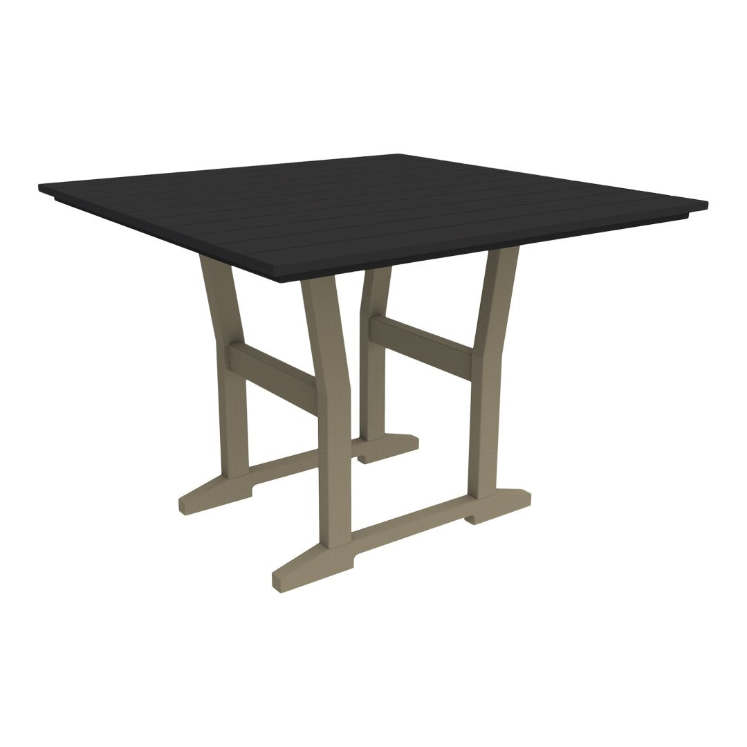 Square table with a sleek black top and stylish beige legs, perfect for modern decor.