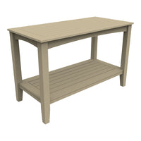 Light beige wooden table with slatted top and shelf, perfect for outdoor decor.