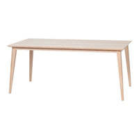 Light wooden dining table with a smooth, natural finish and tapered legs, showcasing a minimalist design.