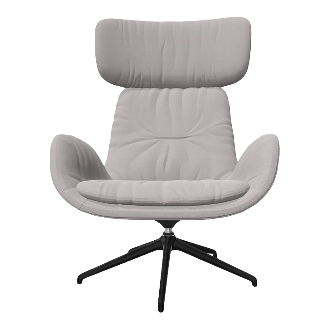 Light gray upholstered chair with a modern design, featuring subtle tufted patterns and a sleek black base.