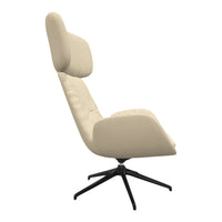 Cream-colored lounge chair with a sleek design and black base, featuring subtle tufted patterns.