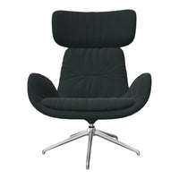 Modern dark green armchair with a plush cushioned design and sleek silver base. Elegant and stylish furniture accent.