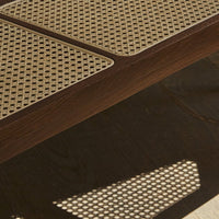 Brown wooden surface with light beige mesh patterns, showcasing a modern and stylish design.
