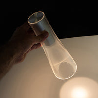 Translucent mesh lamp with a sleek silver finish, showcasing a modern, minimalist design and soft light pattern.