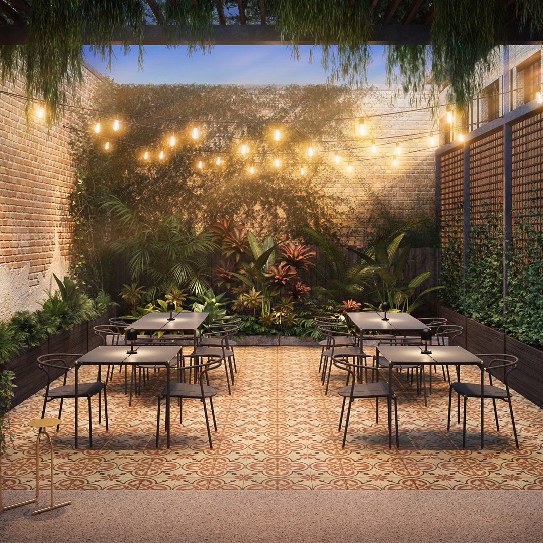 Patterned tile flooring with warm earth tones and a green botanical backdrop, accented by glowing string lights.