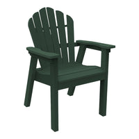 Dark green Adirondack chair with a classic slatted backrest and sturdy armrests, perfect for outdoor relaxation.