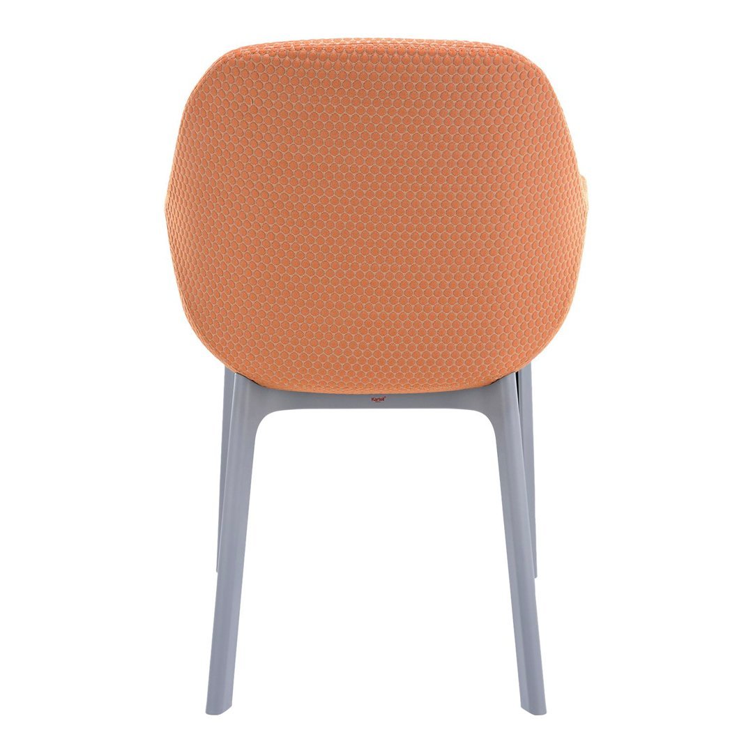 Orange dotted pattern chair back on a light grey frame, showcasing a modern and stylish design.