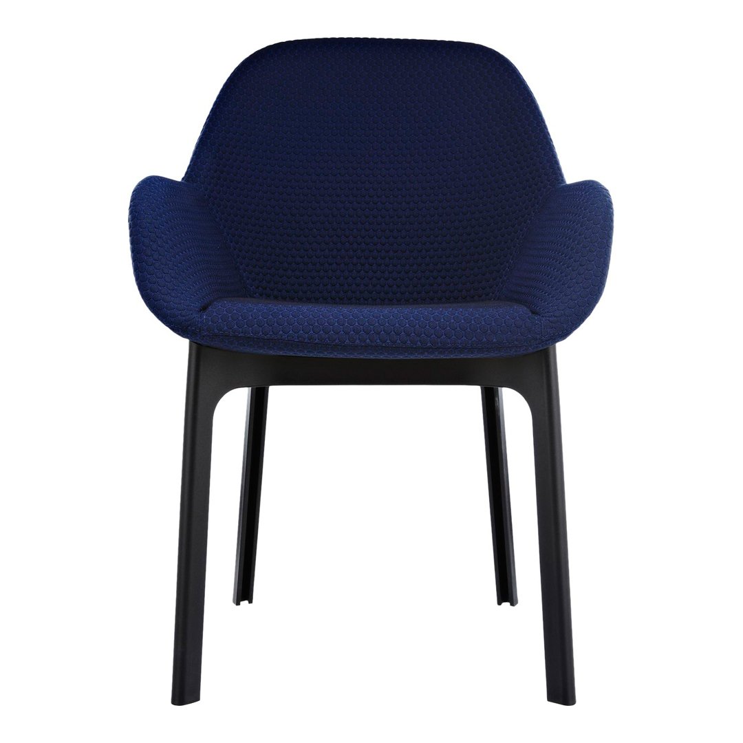 Navy blue chair with a textured pattern and sleek black legs, perfect for modern interiors.