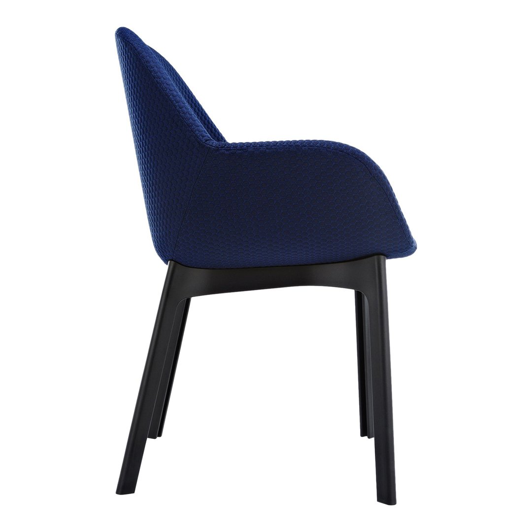 Navy blue upholstered chair with a textured pattern and sleek black wooden legs. Ideal for modern decor.