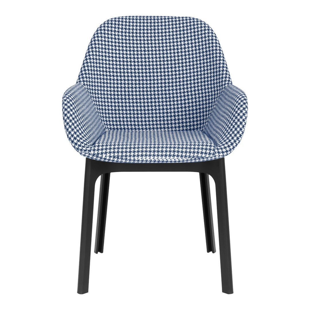 Blue and white houndstooth patterned chair with black legs. Stylish and modern design for any space.