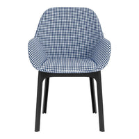 Blue and white houndstooth patterned chair with black legs. Stylish and modern design for any space.