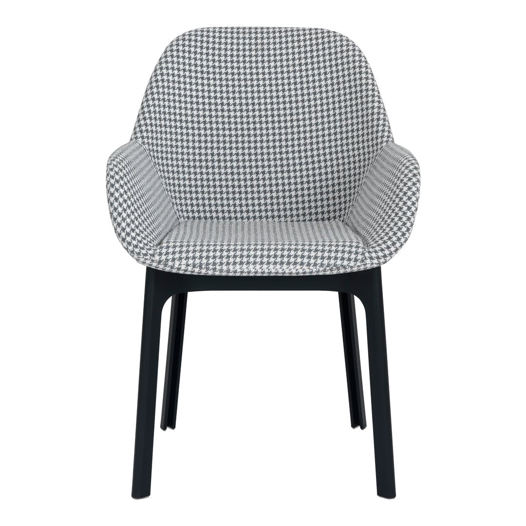 Black and white houndstooth patterned chair with sleek black legs. Modern design for stylish interiors.