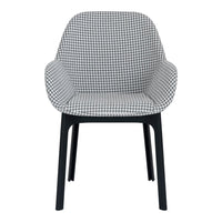 Black and white houndstooth patterned chair with sleek black legs. Modern design for stylish interiors.