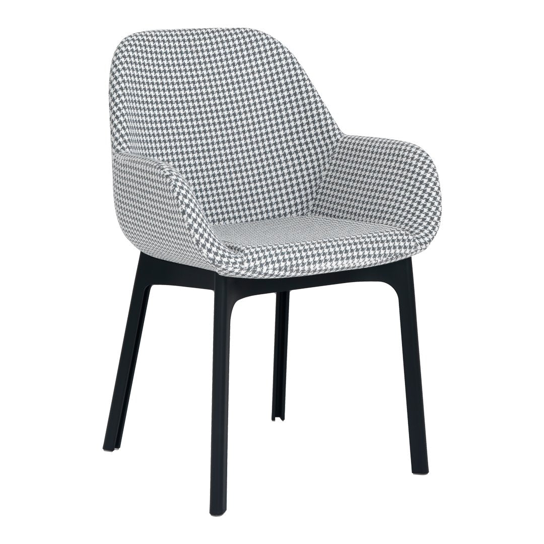 Black and white houndstooth pattern upholstered chair with sleek black legs. Modern design for stylish decor.
