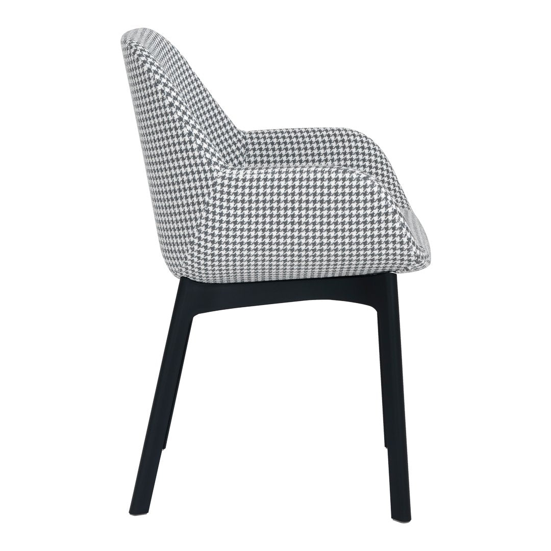 Black and white houndstooth patterned chair with sleek black legs. Side view showcasing modern design.
