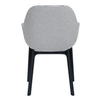 Back view of a chair featuring a black and white houndstooth pattern with sleek black legs.