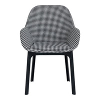 Black and white houndstooth patterned chair with sleek black legs. Stylish and modern design for any space.
